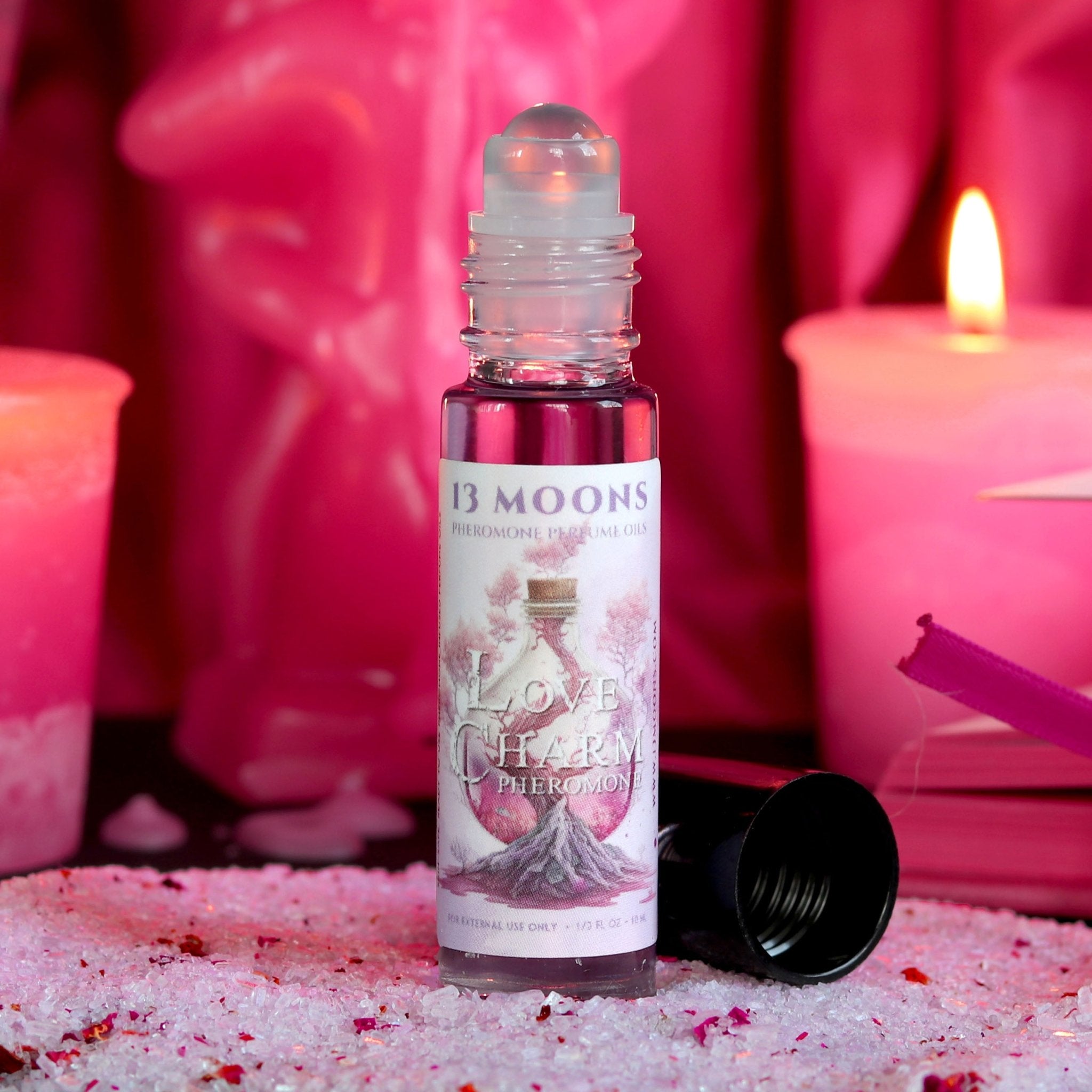 http://www.13moons.com/cdn/shop/products/love-charm-pheromone-infused-perfume-roll-on-oil-by-13-moons-174344.jpg?v=1682573543
