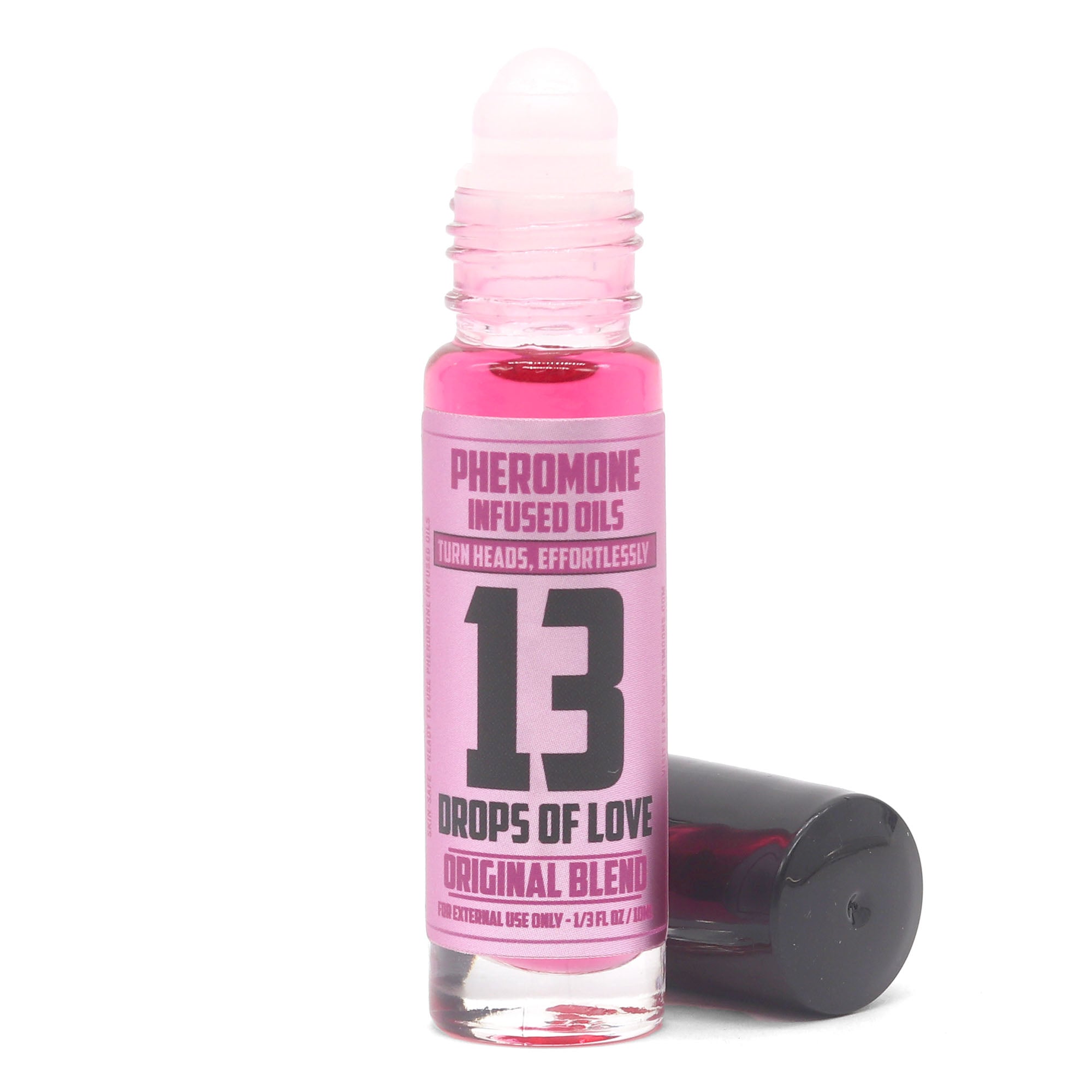 Pink bottle of '13 Drops of Love' Pheromone Infused Oils on a white background