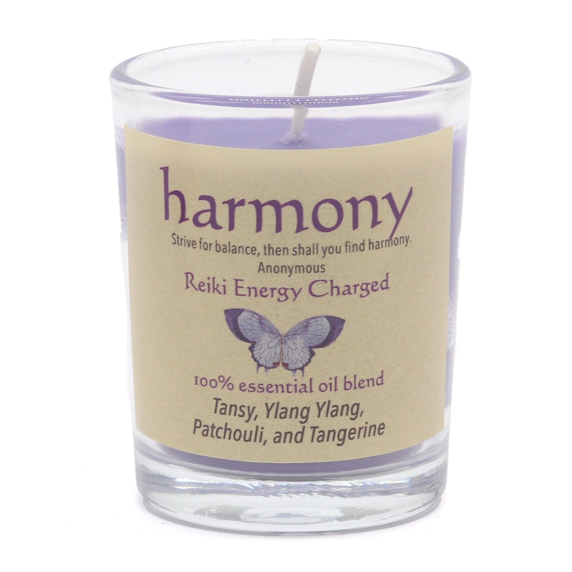 Candle with a label reading 'harmony' and 'Reiki Energy Charged' on a white background