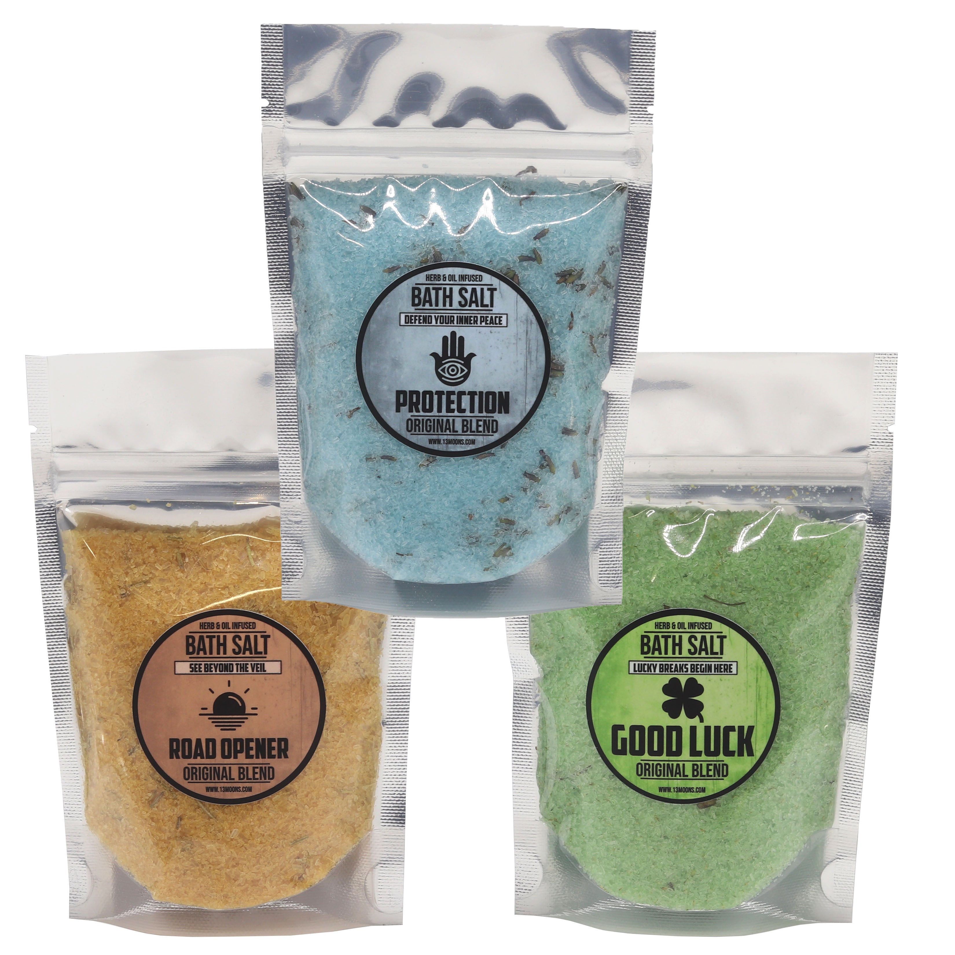 Three packages of bath salts with labels for protection, road opener, and good luck.