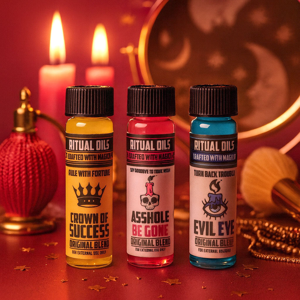 Three bottles of ritual oils with labels on a red background with candles and a mirror.