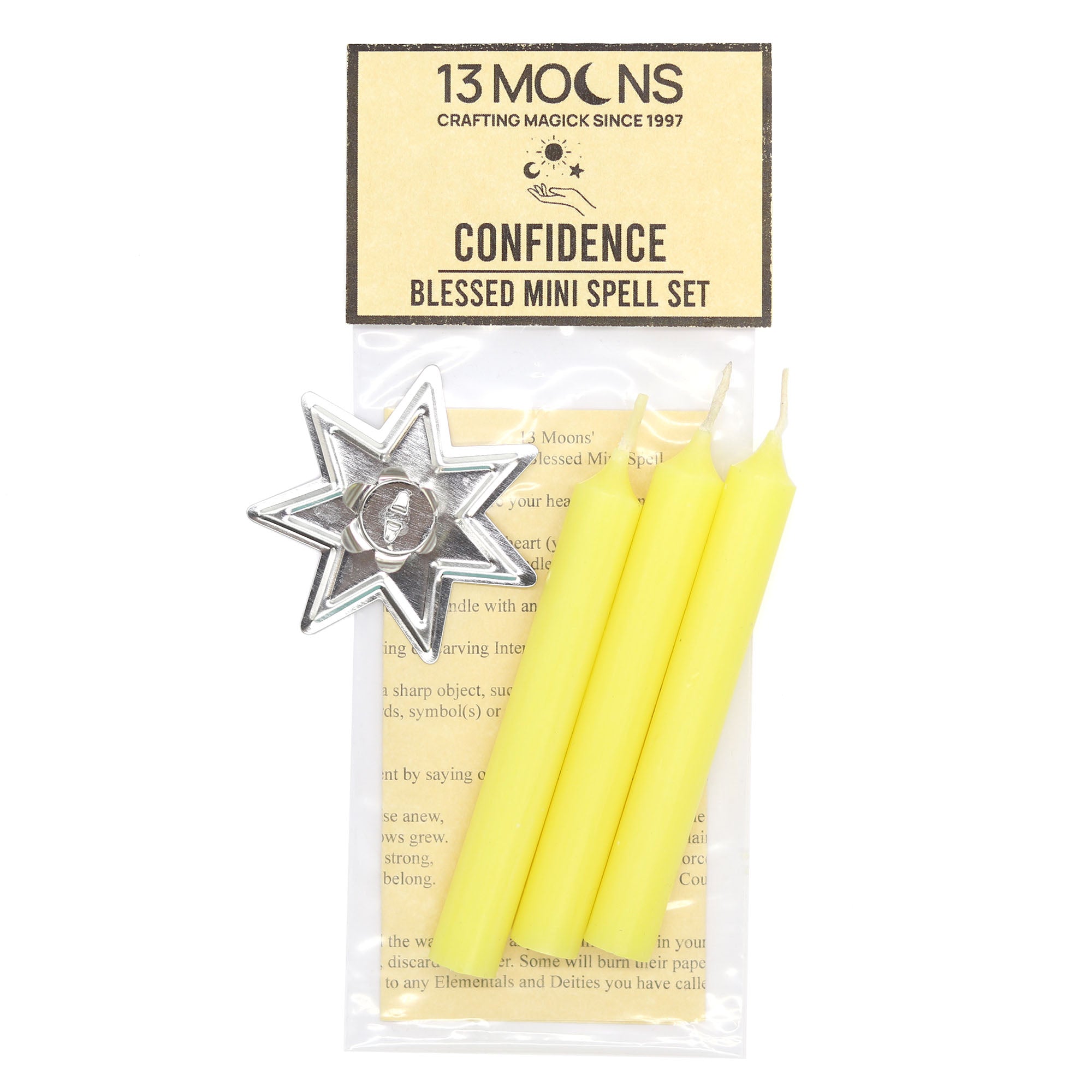 Packaged spell set with yellow candles and a silver star-shaped object, branded '13 Moons'.
