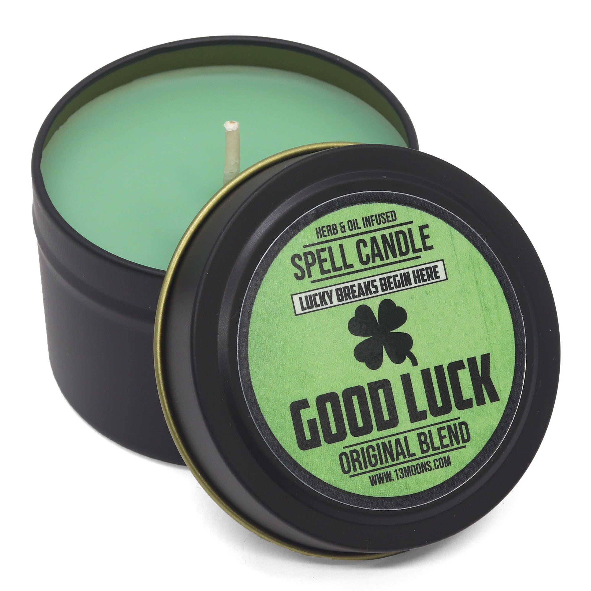 Good Luck spell candle in a black tin with green candle inside, on a white background