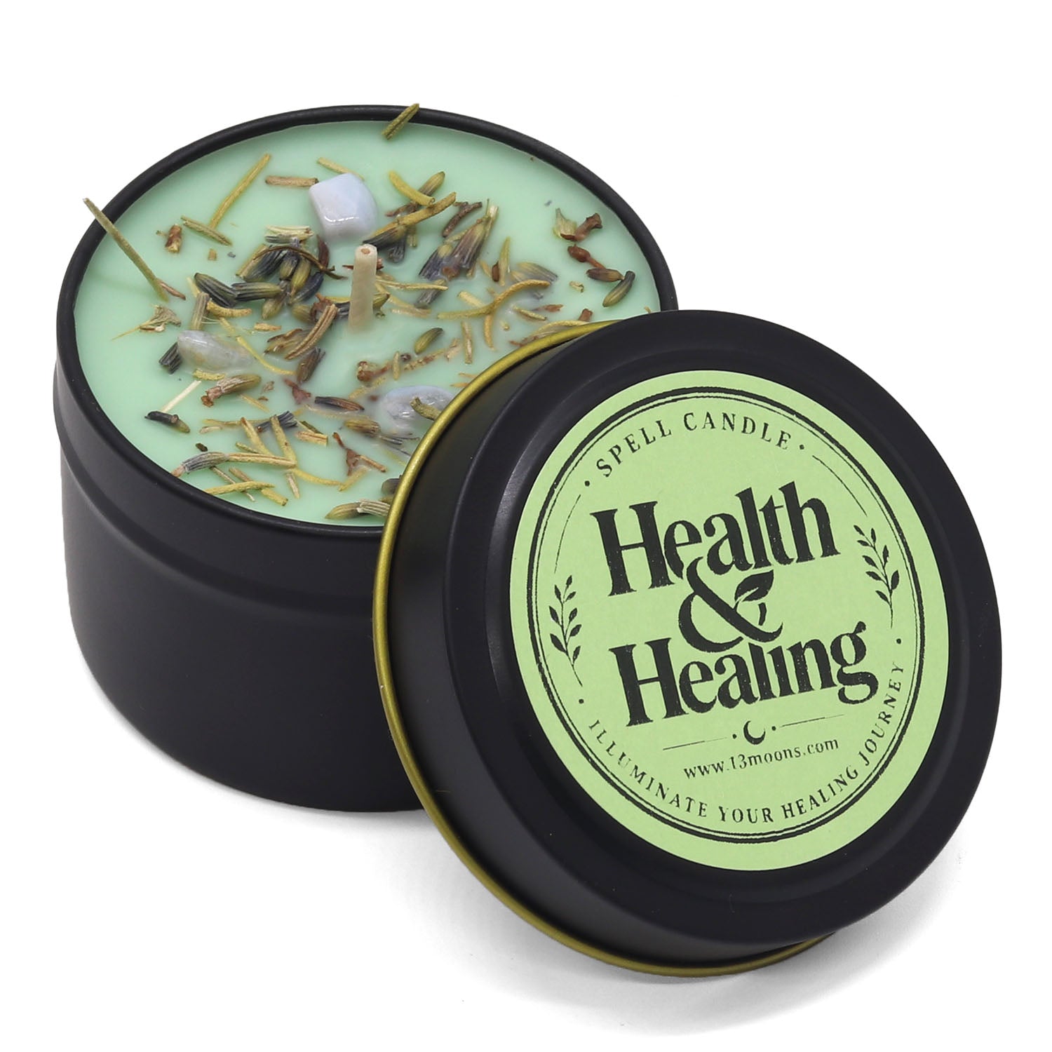 Candle in a black tin labeled 'Health & Healing' with decorative elements on a white background