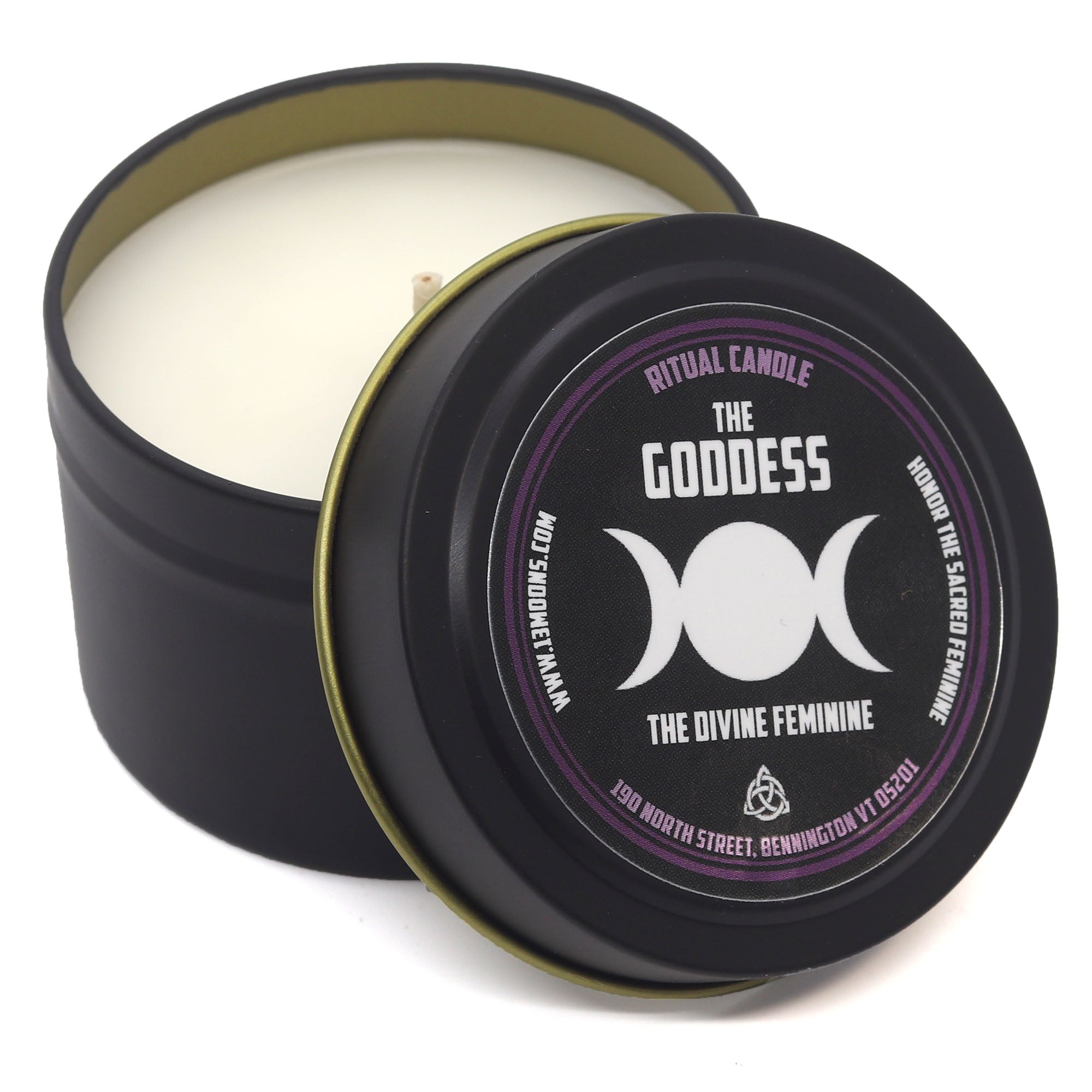 Candle in a black tin with 'The Goddess' label on a white background